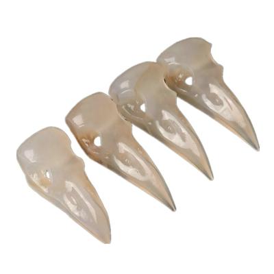 China China Crystal Skulls Hand Carved Crow Head Skulls Craft Agate Quartz Carving Healing Home Decor Pendant for sale