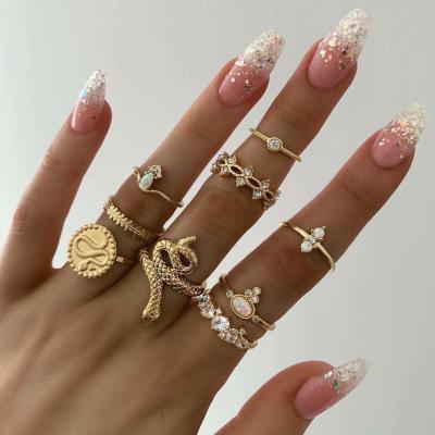 China 9pcs/set Environmental Friendly Rose Flower Star Snake Gold Plated Rings For Women Summer Popular Hollow Ring Set Finger Jewelry for sale