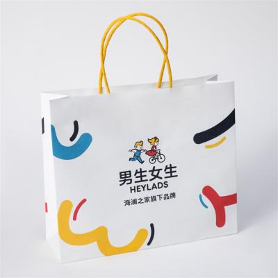 China Recycled Materials Wholesale Custom Logo White Kraft Paper Bag For Clothing Shoes Fashion Design Recyclable Paper Bag for sale