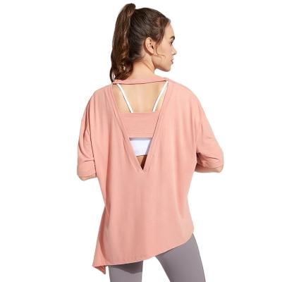 China Ladies Antibacterial Yoga Wear Irregular T Shirt Sports Top Women Hollow Out Bandage Workout Clothes T Shirt Women for sale