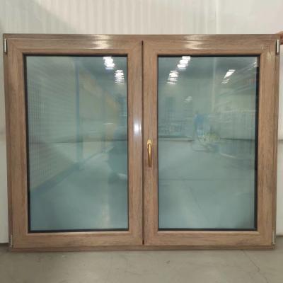 China Ventana giratoria de doble acristalamiento de color madera UPVC para casas de estilo europeo en venta