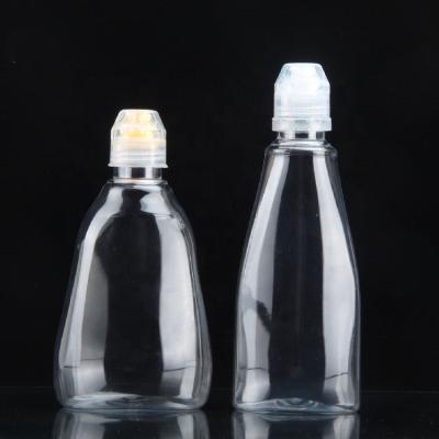 China 500g Transparent Plastic Honey Flat Bottle PET Food Stock Shape Bottle Spout Cover Fall Pear Paste Juice Bottle for sale