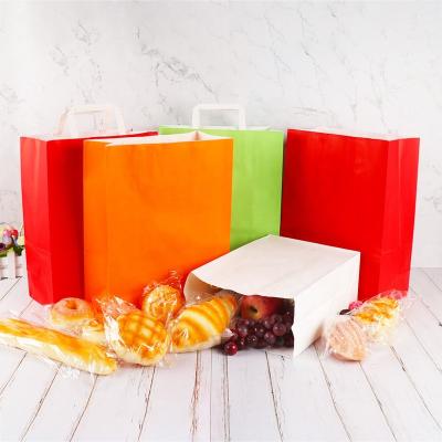 China Recyclable Cheap Orange Craft Kraft Paper Shopping Packaging Bag With Flat Rope Handle for sale