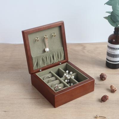 China Receive and send to friends solid wood jewelry box small simple portable jewelry storage box travel earring necklace jewelry box for sale