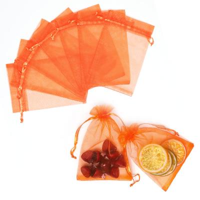 China Gift Wholesale 9*12cm Orange Organza Bags For Party Pockets Cheap Small Drawstring Bag for sale