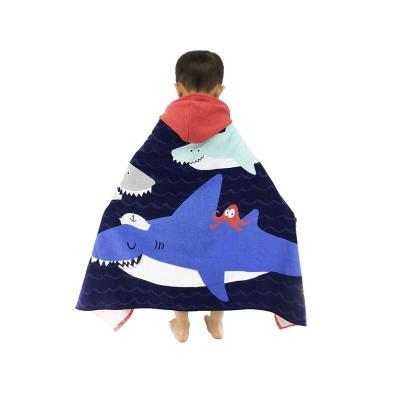 China Compressed 100% cotton towel bath, kids poncho hooded beach towel, poncho surf towel for sale