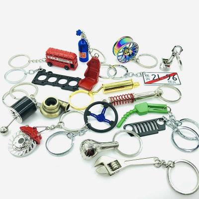 China Exquisite backpack pendant of various models of fashion car key chain auto parts for sale