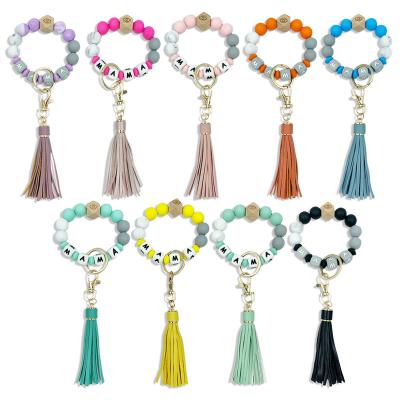 China TRENDY Multicolor Silicone Beads Mom Bracelet Key Chain Beads Keychains Leopard Suede Tassel for Women Girls for sale