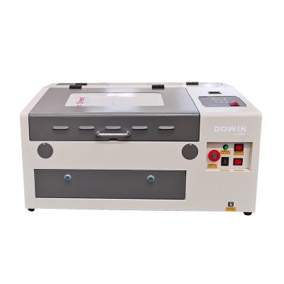 China 40w 50w Water Cooled Low Cost 3040 CNC Engraving Machine CO2 Laser Wood Acrylic Price for sale