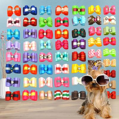 China Stocked Dog Bows with Rubber Bands Multicolor Dog Grooming Bows Cute Pet Hair Accessories Puppy Bowknot for Puppy Hair Decor for sale