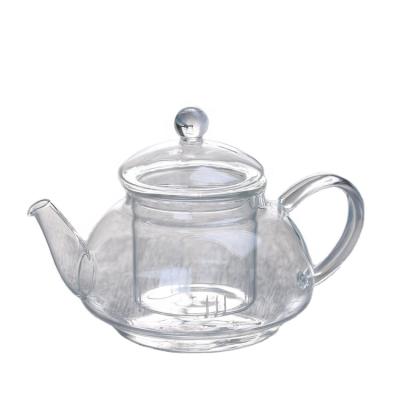 China Stocked Stocked 550m heat resistanthandle custom handmade glass flower teapot with handle for sale