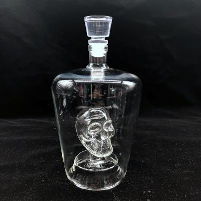 China Creative Glassware 750ml 1000ml Skull Wine Glass Bottle Daily Life Decanter With Cork Wine Glass Bottle Vodka Bottle for sale