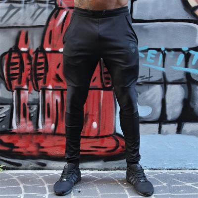 China Custom Logo Men's Sports Gym Antibacterial Pants Casual Breathable Loose Fit Fitness Pants for sale