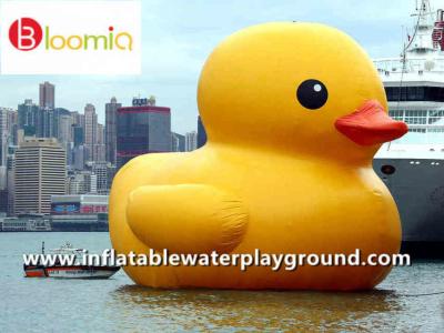 China Airtight PVC Inflatable Yellow Dark Rubber Duck Floating On Sea For Water Games for sale