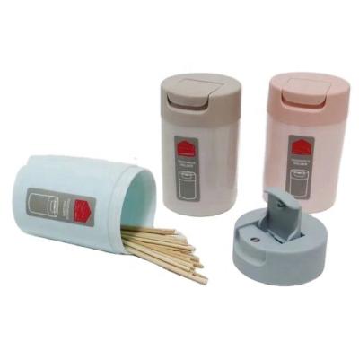 China Stocked Plastic Round Shape Toothpick Dispenser with Flip Lid for sale