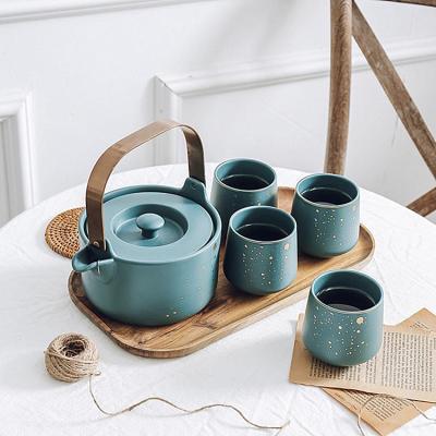 China Sustainable New Arrival Simple Gold Spotted Matte Green Ceramic Teapot Set Tea Cup Sets With Wooden Tray for sale