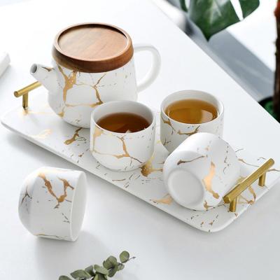 China Hot Selling Luxury Modern Teapot Viable Ceramic 4 Piece Tall Teapot Marble Tea Set Tea Set With Wooden Tray for sale