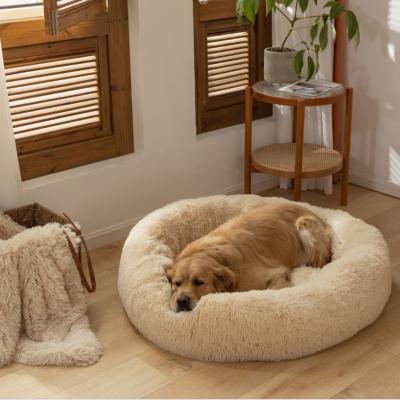 China Viable dog cushion resting soothing dog bed in vegan shag fur donut cuddler pet bed fluffy cat and dog dog for dropshipping fast shipping for sale