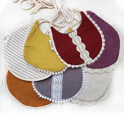 China Cotton Baby Bibs Adjustable Reversible Flower Lace Cotton Soft Infant Viable Pure Organic Canvas Unisex Feeding Bibs for sale