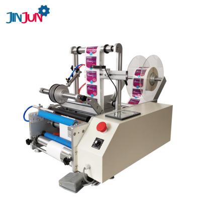 China JINJUN food semi-automatic double-sided round water bottle labeling machine for wine glass boxes knock for sale