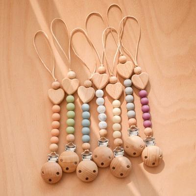 China Silicone Pacifier Chain Clip Wooden Dummy Jacket Holder Clip Medium Caliber en venta