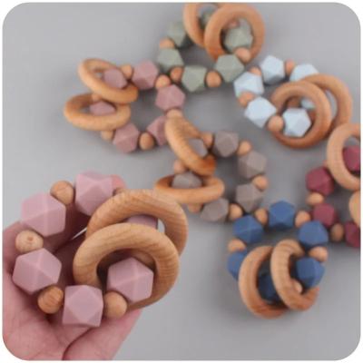 China Baby Teething Toys Rattle Soft Bpa Free Cartoon Wood Baby Teether Ring Kids Food Grade Baby Silicone Teether zu verkaufen