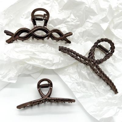 China Fashion Women fashion hair accessories matte brown color hair claw clips hollow geometric styles alloy large hair clips for sale