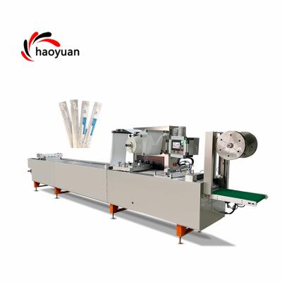 China HAOYUAN Commodities Disposable Medical Product Packing Machine / Blister Vacuum Thermoforming Packing Machine For Syringe Plastic Packaging for sale