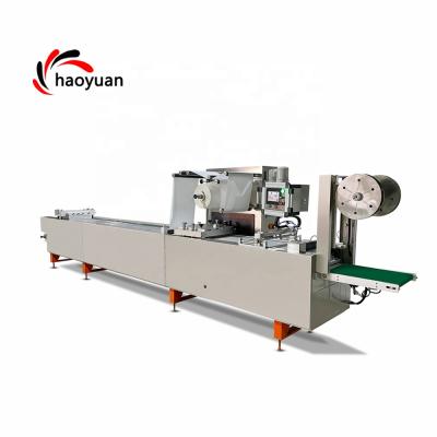 China Food Haoyuan HY-320 Medical Consumables Infusion Tube Thermoforming Packing Machine for sale