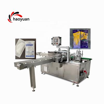 China HY-100 HAOYUAN automatic food bag packing machine for finishing bag towel veterinary medicine disposable nonwoven pe gloves for sale