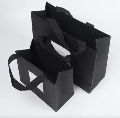 China New Customer Logo Thickened Kraft Paper Clothing Gift Bag Recyclable Skin Care Tote Bag for sale