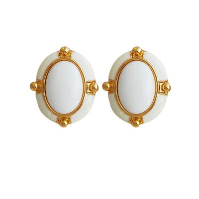 China 2022 FASHIONABLE luxury alloy jewelry geometry earrings button to form white enamel temperament stud earrings for sale