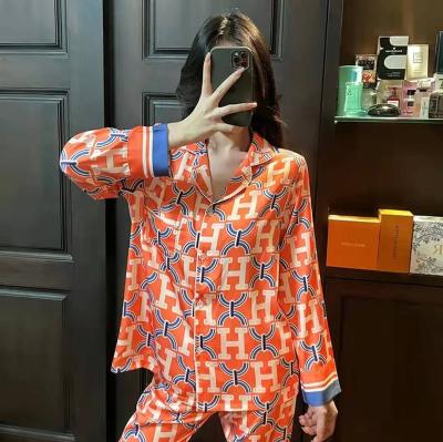 China 2022 QUICK DRY designer printing silk pajamas spring and autumn internet red explosive ice silk home set for sale