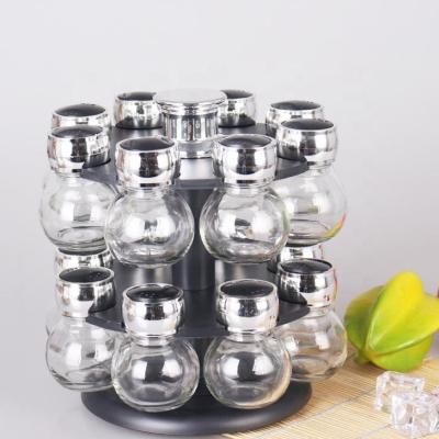 China Freshness Preservation 16pcs/set Round Shape Glass Spice Jar Set With Double Layer Plastic Rotating Rack for sale