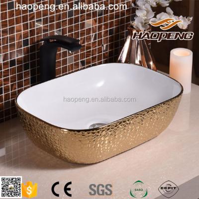 China Middle East Sanitary Ware Bathroom Gold Ceramic Wash Basin for sale