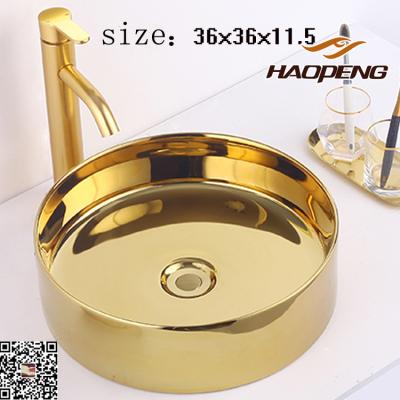 China China Modern Ceramic Roud Shine Gold Basin Art Basin Bathroom Sink for sale