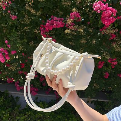 China 2021 summer new fashion cloud pocket net messenger red ocean bag small brand large armpit bag pearl chain female for sale