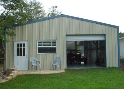 Chine Le métal résistant au feu a jeté le bâtiment de garage/garage en acier de stockage avec la porte électrique à vendre