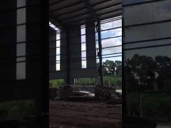 Prefab Welded Steel Structure Warehouse With Rolling Door