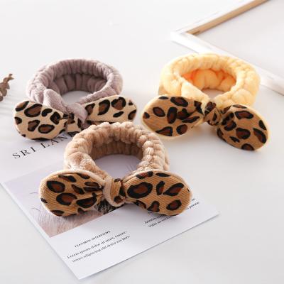 China Leopard Trendy Bow Tie Fashion Hair Band Women Headband Elastic Hair Band For Make Up Wash Face for sale