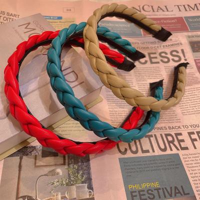 China 2012 popular European and American leather braid triangle PU headband ladies cotton filled headband of the new style for sale