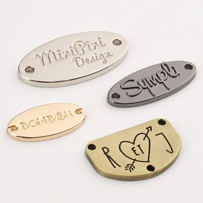 China Metal Custom Sewing Labels Engrave Garment Bikini Metal Logo Tag For Clothing for sale