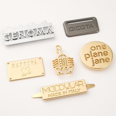 China Zinc Alloy Hollow Engraving Metal Logo Cut Out Plate Tags for sale