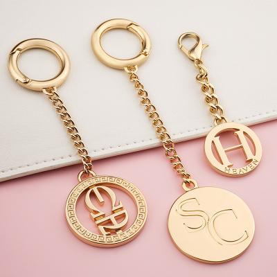 China Handbag Hardware Accessories Round Metal Hanging Tag with Customized Shape Metal Tag for sale