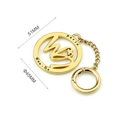 China Customized Gold Hollow Logo Metal Name Tag for Round Shape Eco-friendly Handbags for sale