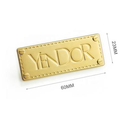 China Customized Logo Metal Label Plate for Luxury Handbags Gold Finish Decorative Screws for sale