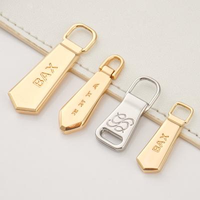 China Luggage Handbags Hardware Accessories Custom Zip Pullers Head 3 Gold Nickel Zipper Pulls for Bags Te koop