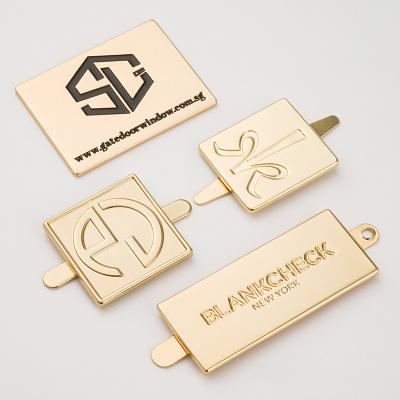 China 100% Inspection Metal Label Custom Metal Logos Plates Gold Metal Tag for Handbag zu verkaufen