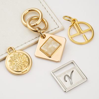 China Die Casting Process Garment Bag Keyring Metal Label For Diy Accessories Jewellery en venta