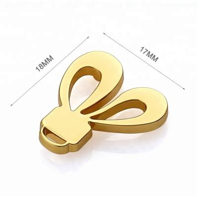 Cina Customized Fashion Bunny Ears Shape Design Gold Metal Logo for Small Purse and Wallet in vendita